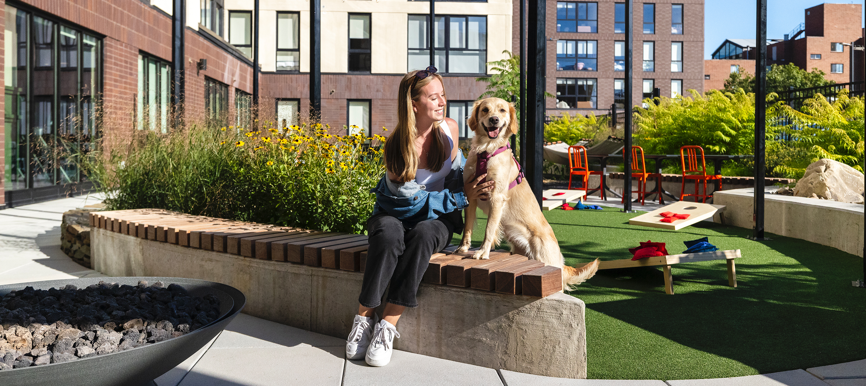 Young woman and her dog enjoying the outdoors