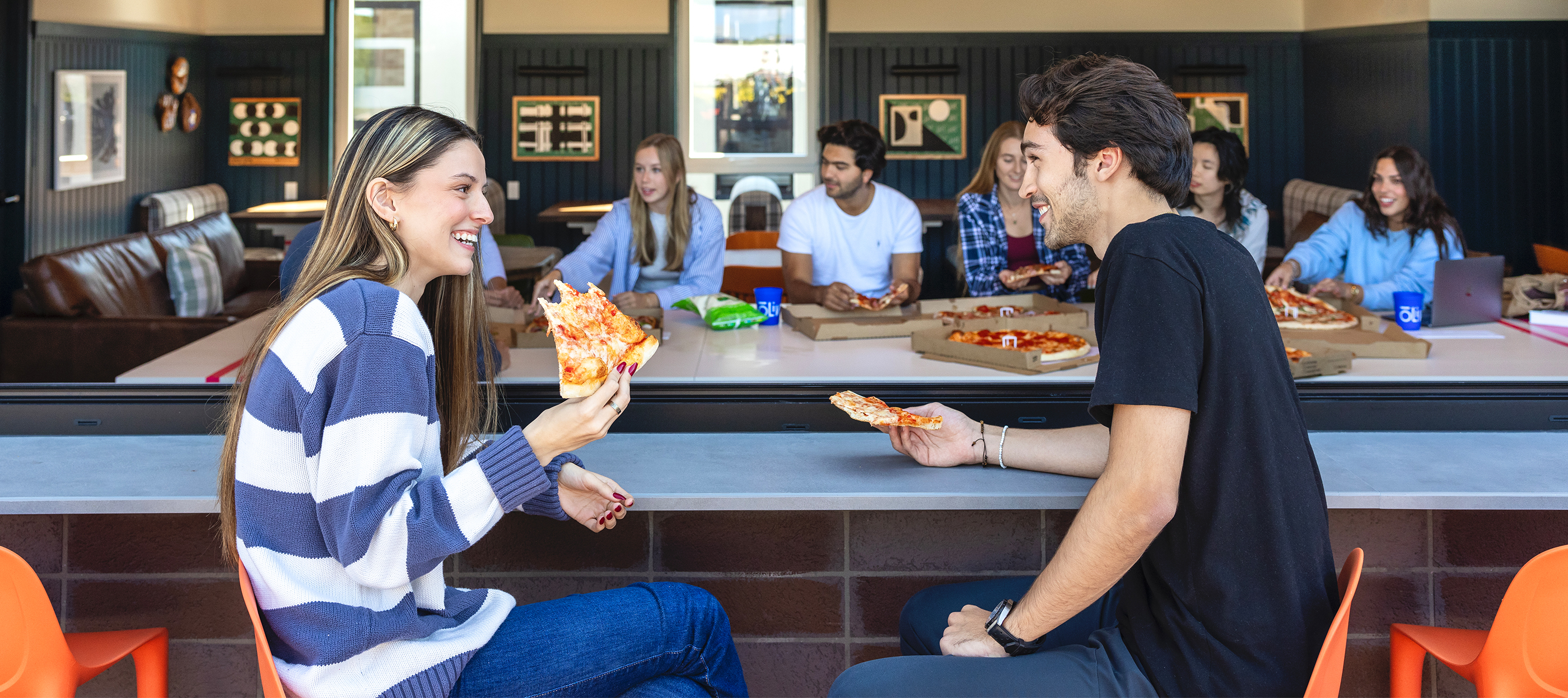 Group of young adults enjoying pizza